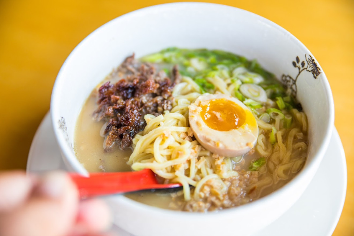 Soup with mixed vegetables , meat and boiled egg