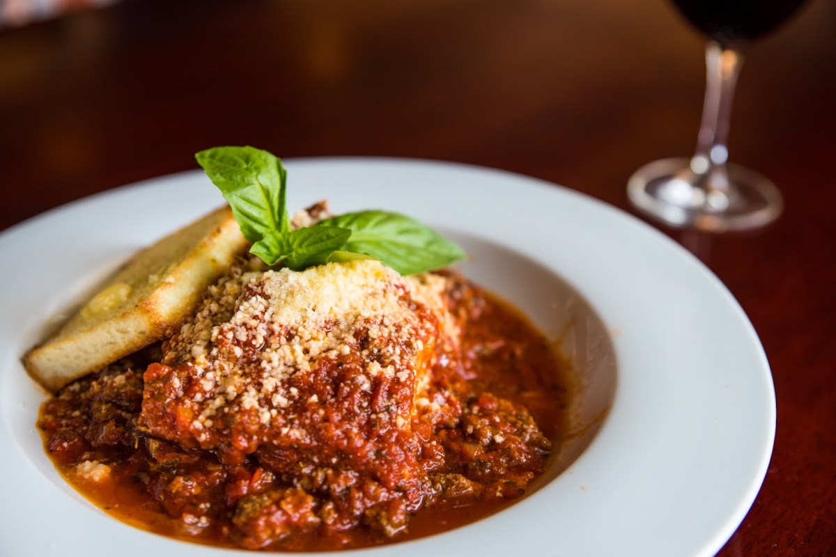 Meatball with tomato sauce, bread on the side
